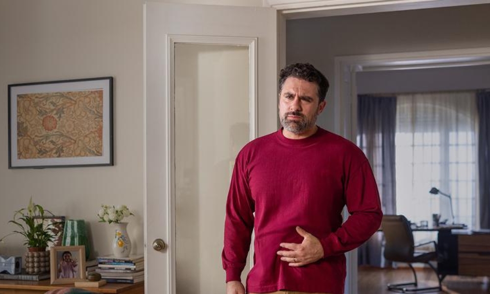 Healthcare provider explaining the common causes of sudden abdominal pain and treatment options